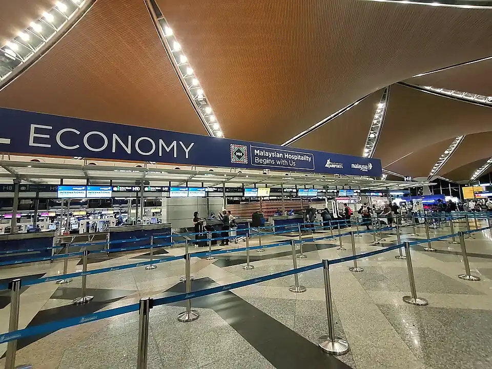 Check-in counters under the wooden roof of KLIA Terminal 1