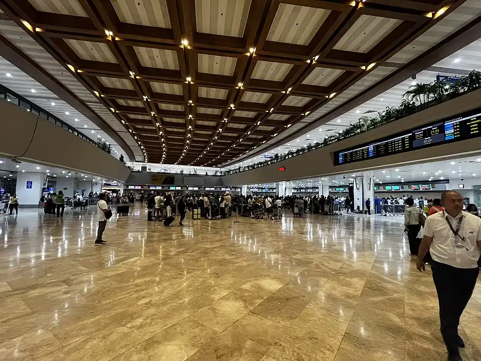 The hall of NAIA Terminal 1 in Manila with its coffered ceiling and polished floor