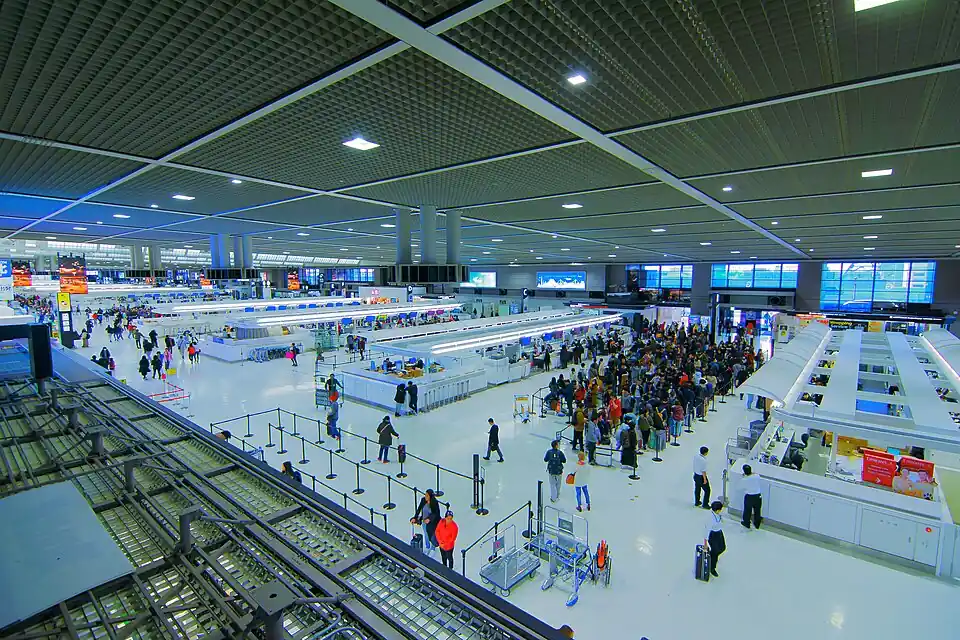The busy departure lobby of Narita Airport Terminal 2 seen from above