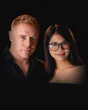 Tim and Paemi, who run Pattaya Pets, side by side in black.